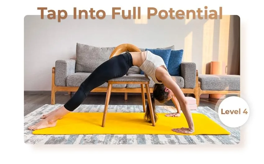 ap Into Full Potential - Hanna demonstrating a deep backbend using a chair for support on a yellow mat, showcasing Level 4 of Circus Stretching.