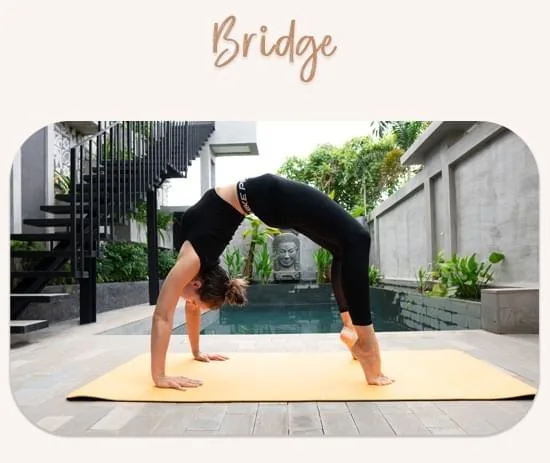 Hanna Pliasetski performing a bridge pose on a yoga mat outdoors by a pool.